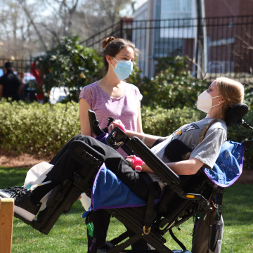 Reagan and occupational therapist Leah Cardi chat in Shepherd Center’s Secret Garden.